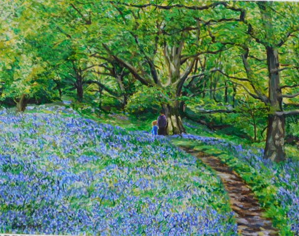 Bluebell woods with two figures in the distance